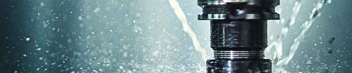 A drill going into water making it splash up